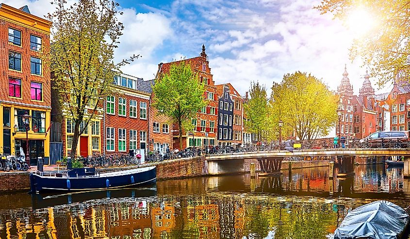 Channel in Amsterdam Netherlands houses river Amstel landmark