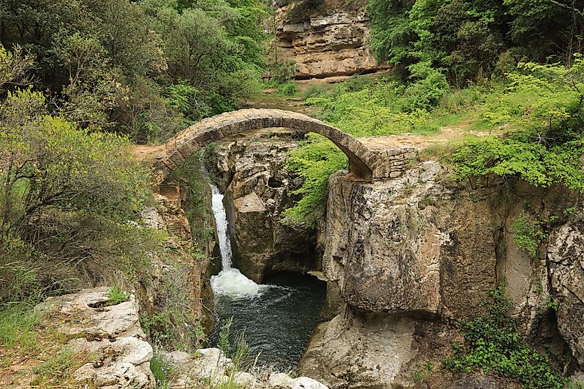 Pont Romain, a restored Roman bridge crossing the Gorges de la Blanque near Bugarach in Aude department, southern France. Via Shutterstock / Niall F.