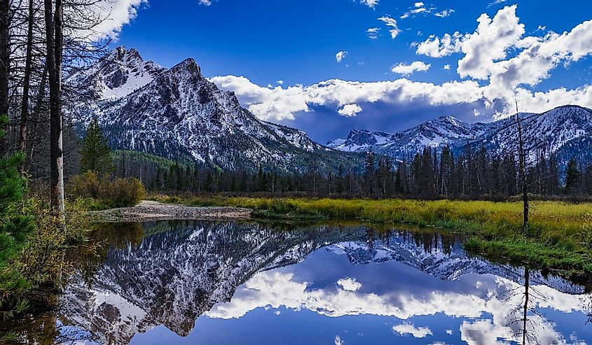 McGown Peak near Stanley Idaho reflected in a pond located in a wetland area near Stanley Lake.