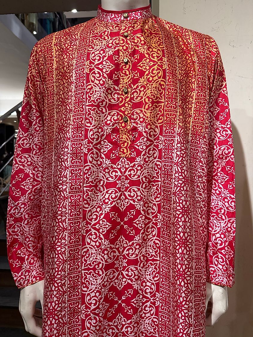 A mannequin wearing a red and white patterned kurta. 