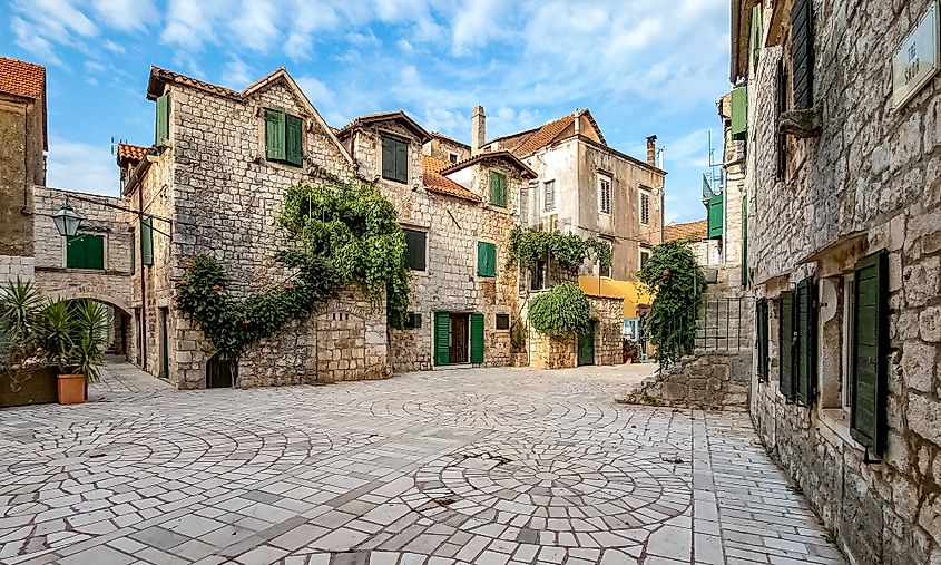 Medieval stone square in Stari Grad, a historic old town on Hvar Island in Dalmatia, Croatia.