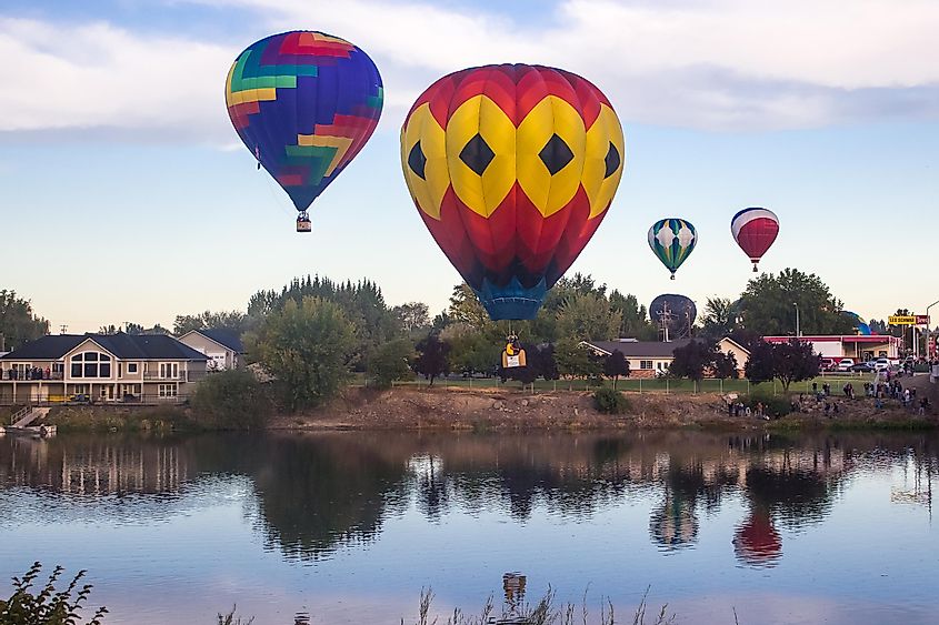 Giant balloons are flying over Yakima river. The 25th Annual Giant Balloon Rally in Prosser, via Victoria Ditkovsky / Shutterstock.com