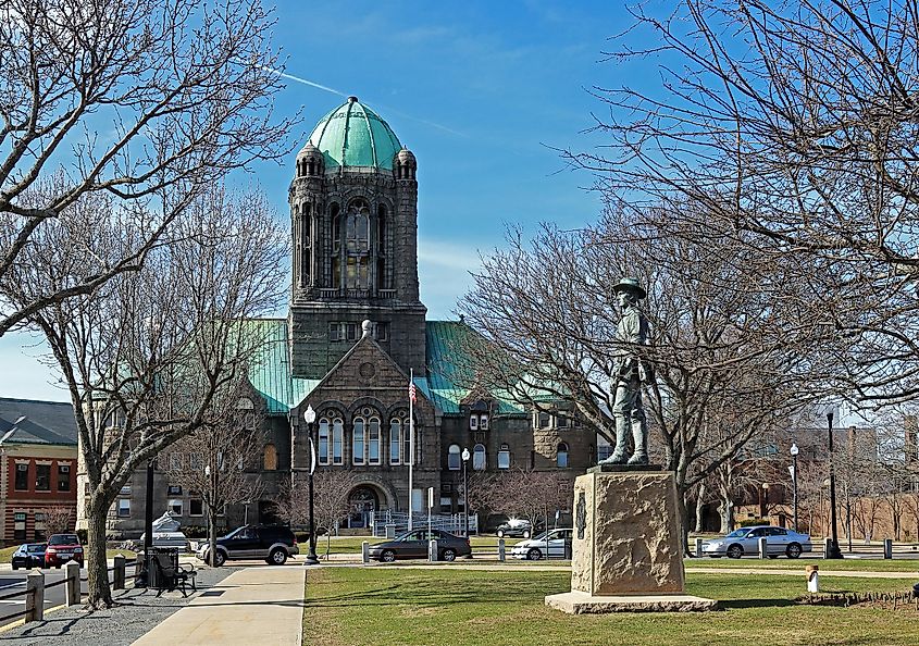 The Bristol County Courthouse building and The Hiker statue in Taunton Green Historic District, Taunton, Massachusetts