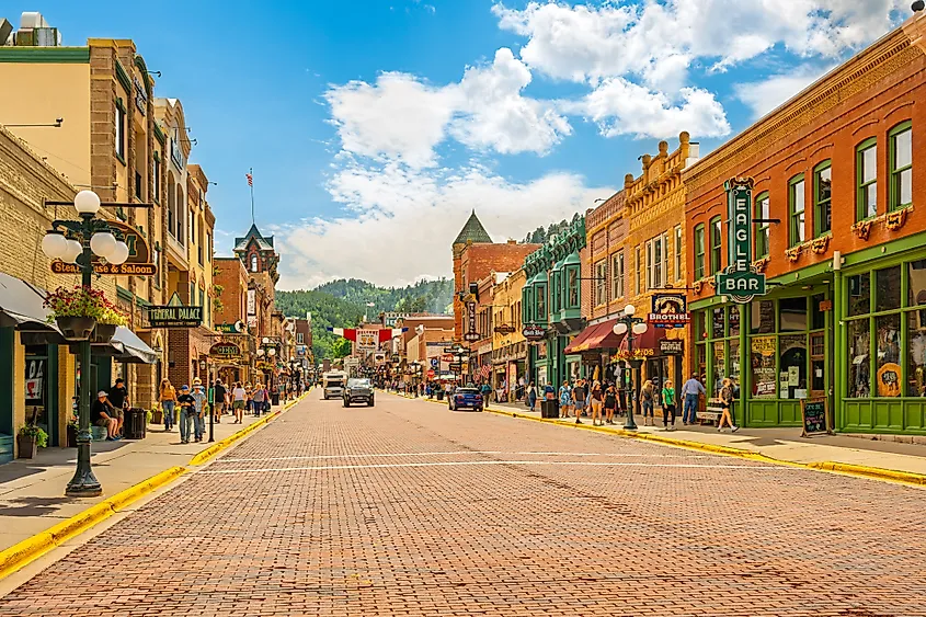 Historic Old West 19th century buildings with saloons, shops and cafes along the brick paved Main Street of Deadwood, in the Black Hills of South Dakota