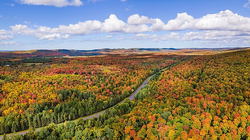 US Route 2 snaking its way through spectacular fall landscape of Michigan's Upper Peninsula.