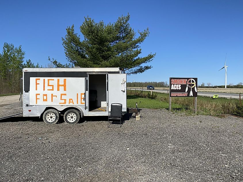 A roadside trailer advertising fish for sale at a First Nation dispensary