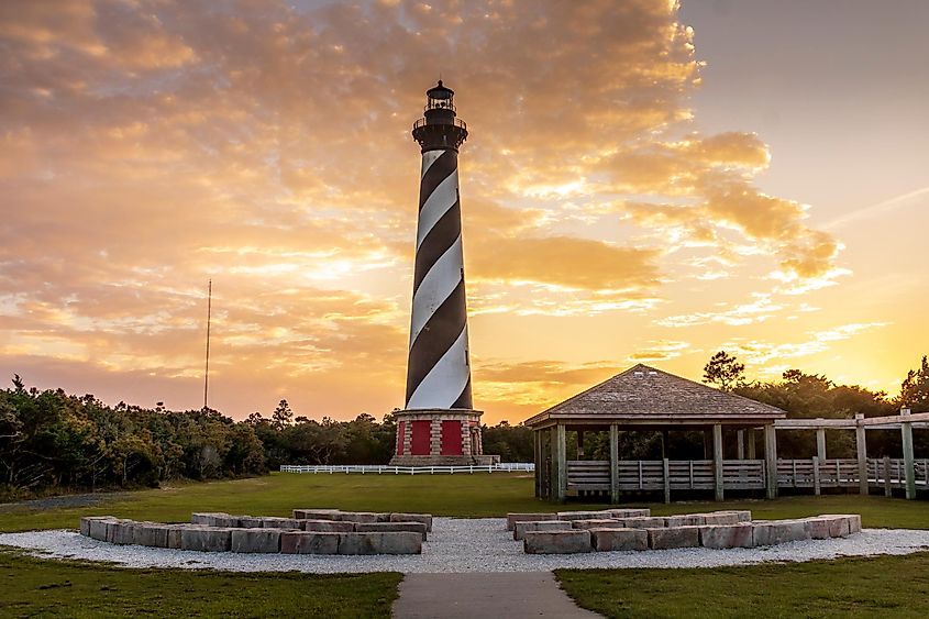 Cape Hatteras Lighthouse during an orange sunset.