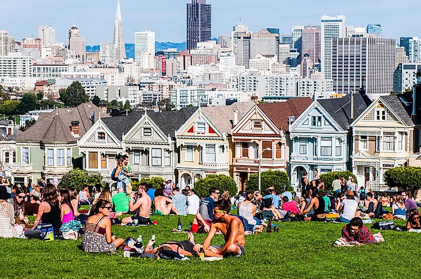 People enjoing the sunny dat at Alamo Square, by the Painted Ladies, San Francisco, California, USA. Editorial credit: Hayk_Shalunts / Shutterstock.com