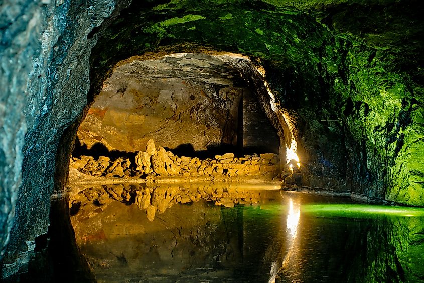 Rock wall reflected in underground lake, Seegrotte in Hinterbruhl, Lower Austria.