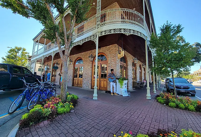 Man playing guitar in the downtown historic district in Fairhope, Alabama.