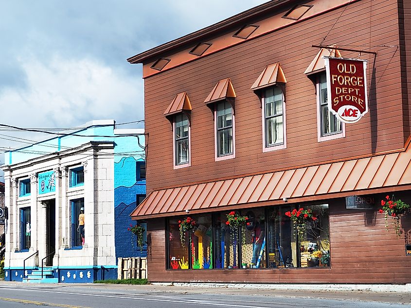 Old Forge, New York, offers a charming scene along Route 28 during the summer season, with shops and businesses lining the picturesque Adirondack town.