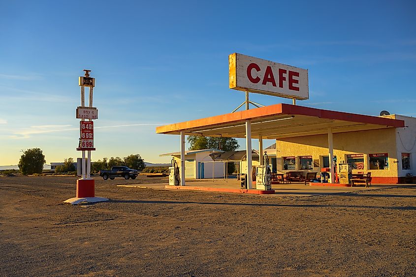 Roy's vintage cafe and gas station with neon sign in Amboy along historic Route 66 in Mojave Desert.