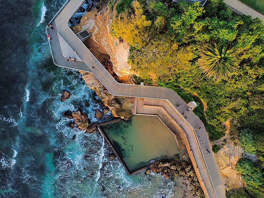 An aerial view of the boardwalk, ocean pool, and bay near Terrigal on the Central Coast of New South Wales, Australia