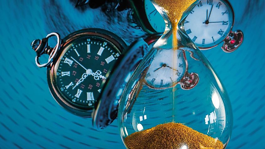 An hourglass, symbolizing the concept of spacetime, where time is depicted as a dimension intertwined with space, reflecting the theory of general relativity in physics.