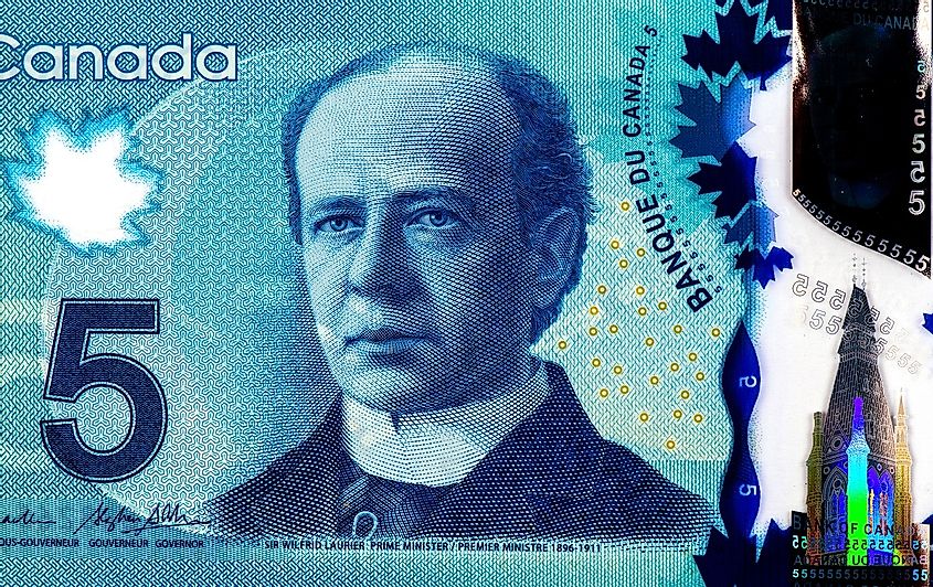 The Canadian 5-dollar bill displays a picture of a young Wilfrid Laurier.