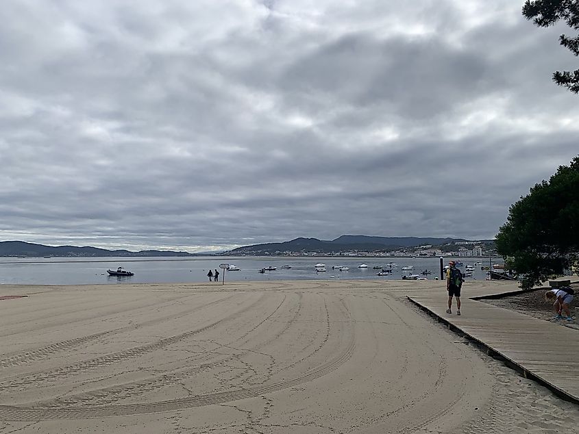 A beachside bay full of small motor boats. 