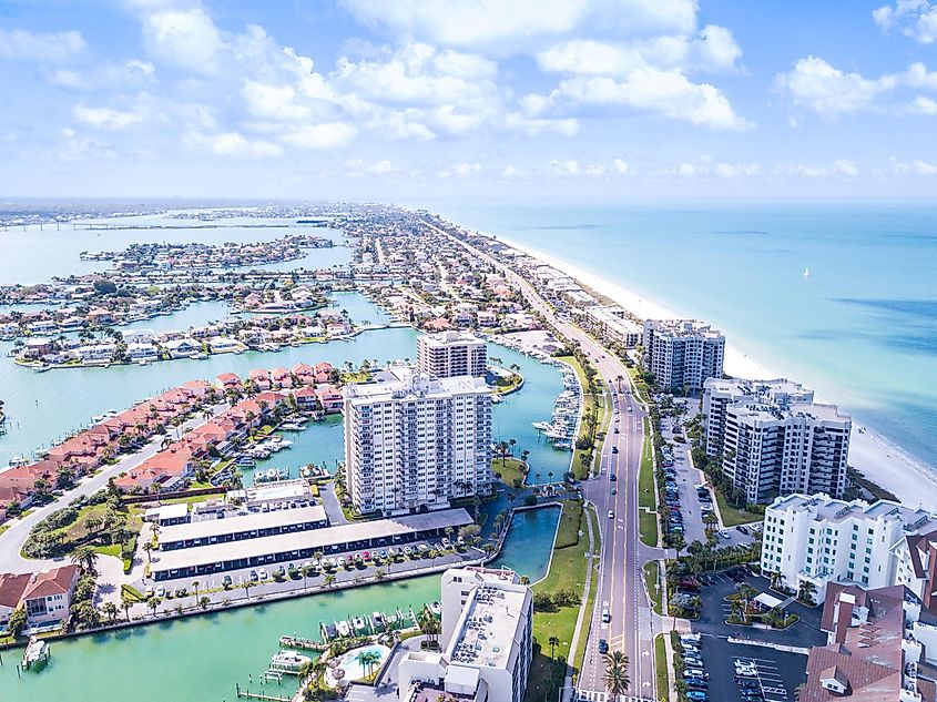Island in Gulf of Mexico. Ocean or shore. Spring break or Summer vacations in Florida. Hotels, restaurants and Resorts. Tropical Nature. Clearwater Beach FL. Aerial view.