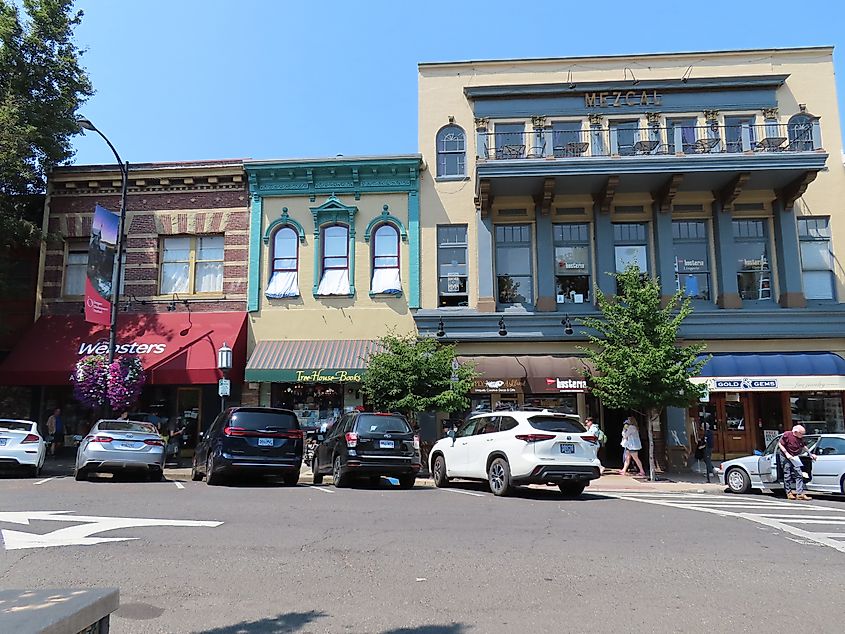 Melissa Herzog via Shutterstock. Ashland, OR USA July 26 2024: Old buildings turned in to stores and restaurants with parking and cars out front and unidentified people in Ashland Oregon on a sunny summer day.