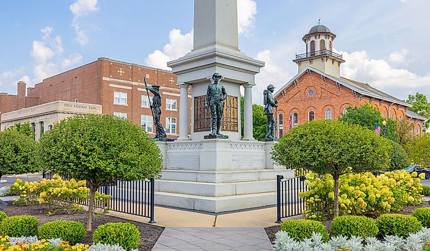 The Steuben County Soldiers Monument in downtown Angola, Indiana, with the Courthouse in the background