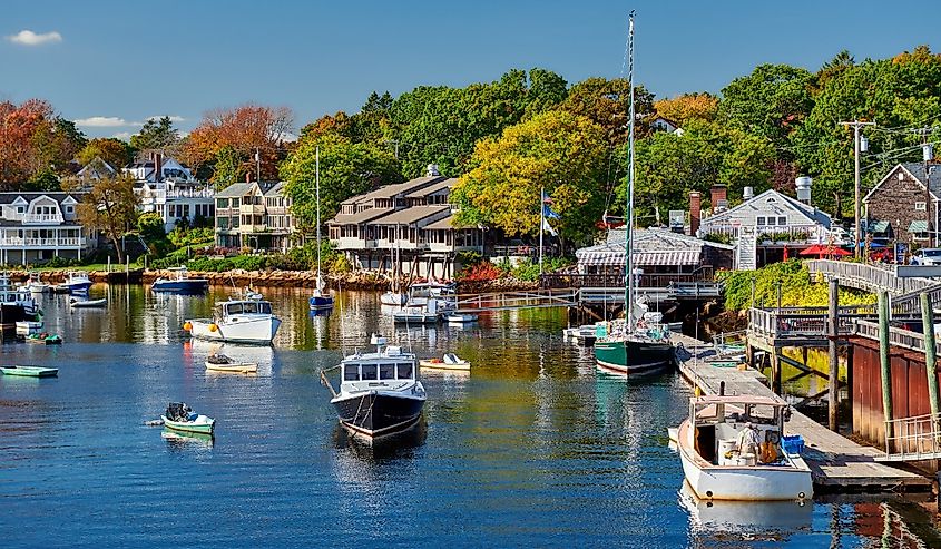 Fall colors and boats in Perkins Cove, Ogunquit, on the coast of Maine.