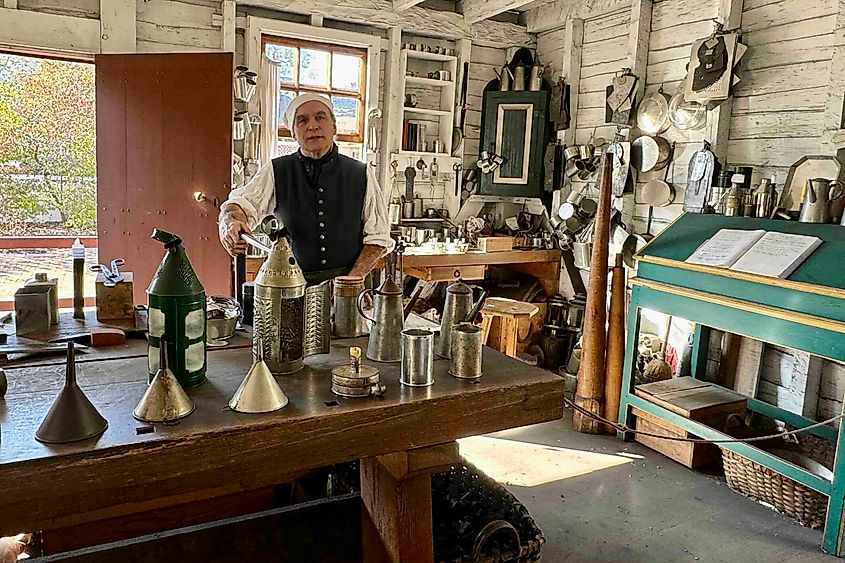 Colonial Williamsburg tinsmith at revolutionary sites in Virginia Photo by Bryan Dearsley revolutionary war sites in Virginia
