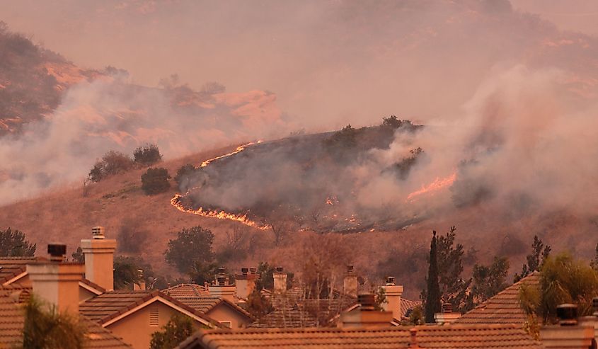 A view of the spreading flames from the Canyon Fire 2 wildfire in Anaheim Hills and the City of Orange