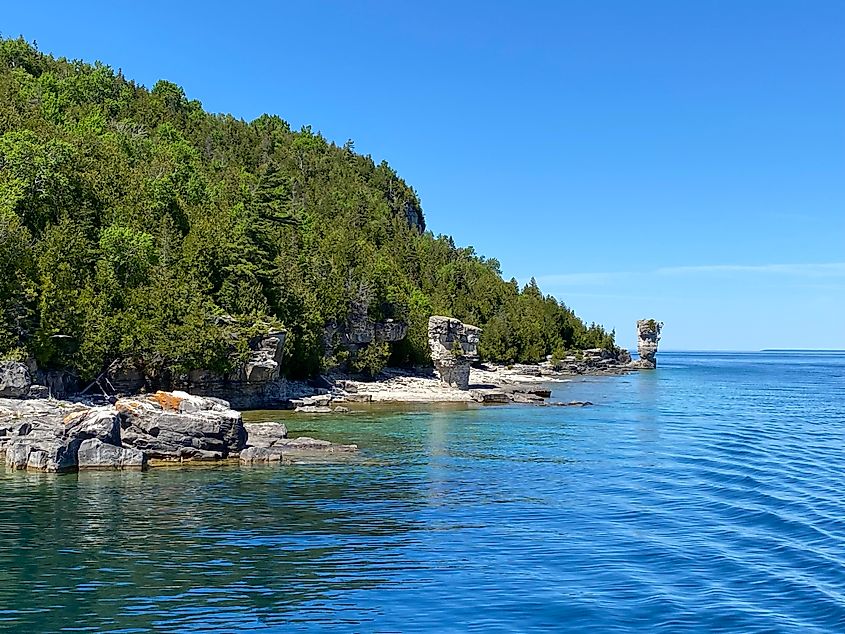Dolostone pillars known as “Flower Pots” line the shore of a heavily-forested island 