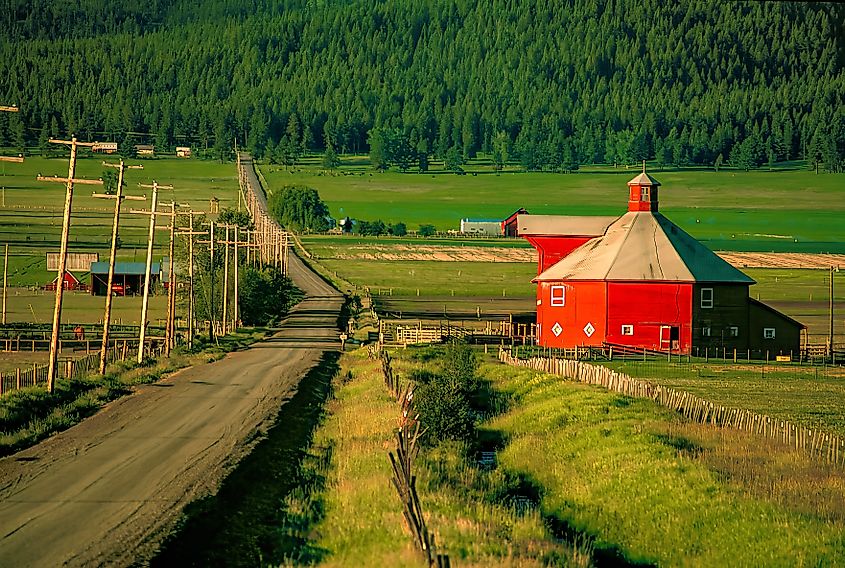 Editorial Photo Credit: Bob Pool via Shutterstock. Red octagonal barn near the Wallowa Mountains.