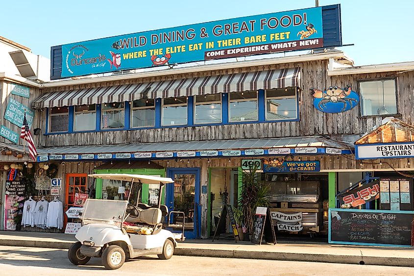 Shops and restaurants are open for business along the Gulf of Mexico waterfront in Cedar Key, Florida.