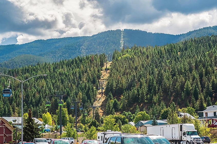 The Silver Mountain Resort ski lift gondola going up the mountain at summer in the city of Kellogg, Idaho