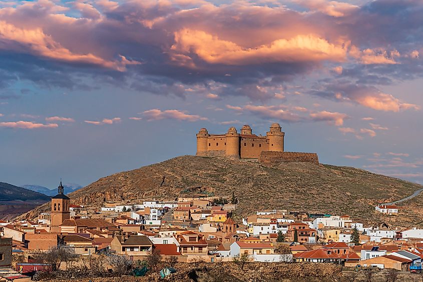 The village of La Calahorra with its Renaissance castle on top of a hill, Granada, Spain