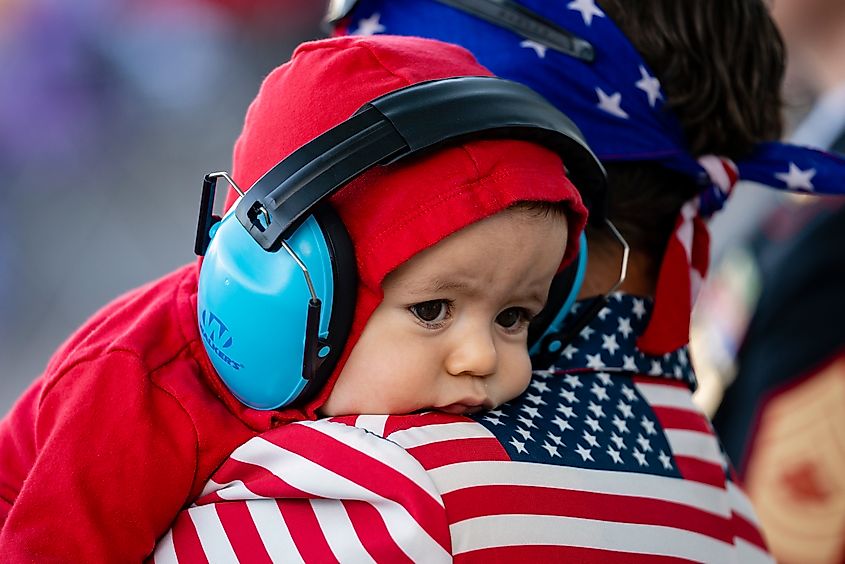 Child and father at a Fourth of July event in Pleasant Grove, Utah.