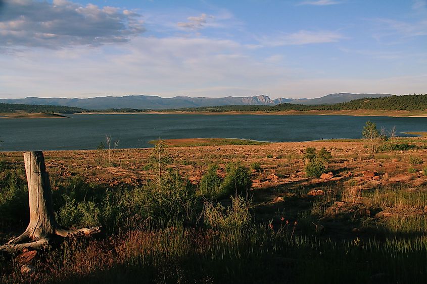 Late afternoon sun settling in over Lake Heron in New Mexico with views of the mountains in the distance. 