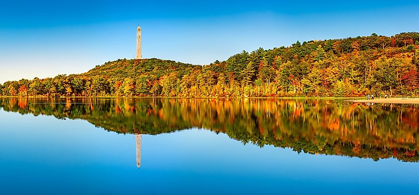 Colorful fall foliage reflects in Lake Marcia.