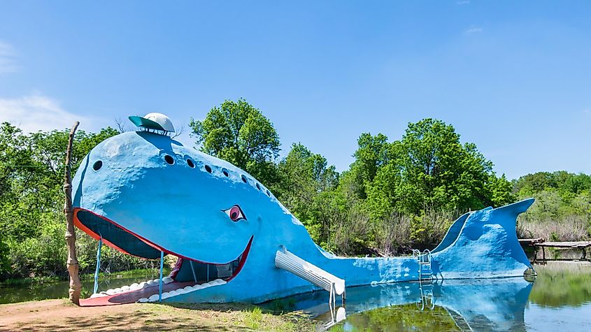 Iconic Blue Whale floating in "Natures Acres" pond, on Route 66. Builder: Hugh Davis