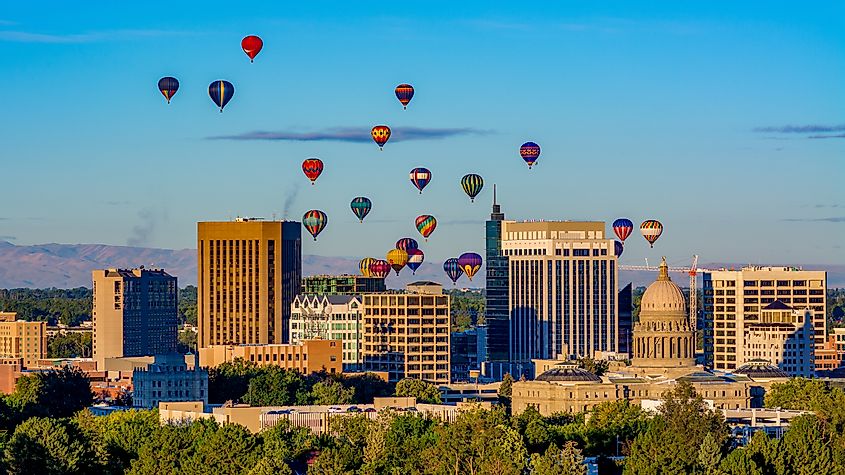 Capital and skyline of Boise Idaho with balloons in flight.