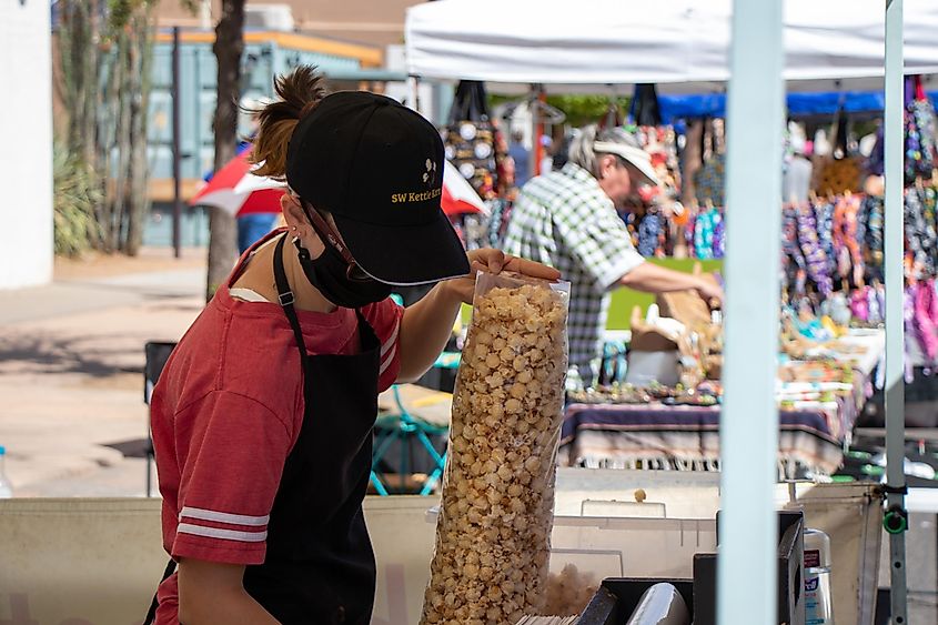 Las Cruces, New Mexico, USA - April 23, 2022: Person selling kettle corn at a market in Las Cruces, New Mexico