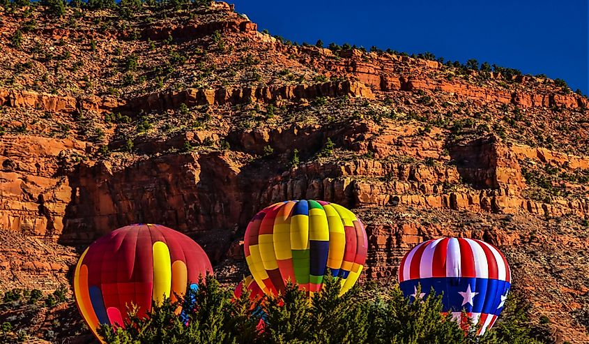 Hot Air Balloons rise above the desert landscape in Kanab, UT. The annual Balloons and Tunes Festival takes place each Presidents Day weekend in Kanab.