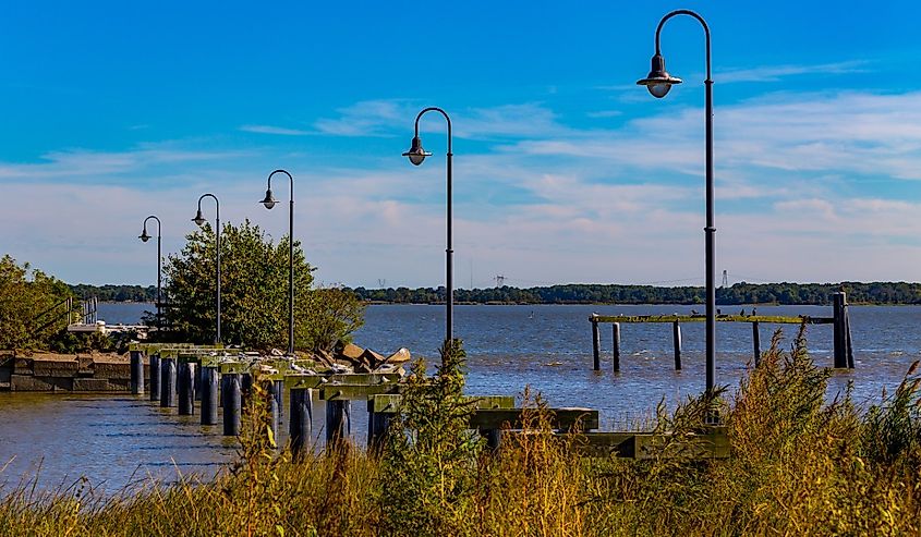 Remains of a damaged dock and pier stands in the Delaware River, New Castle, Delaware.