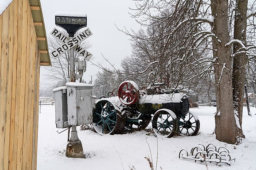 Editorial Photo Credit: Patrick Messier via Shutterstock. Old, abandoned farm equipment in a beautiful winter setting in Coldwater, Ontario.