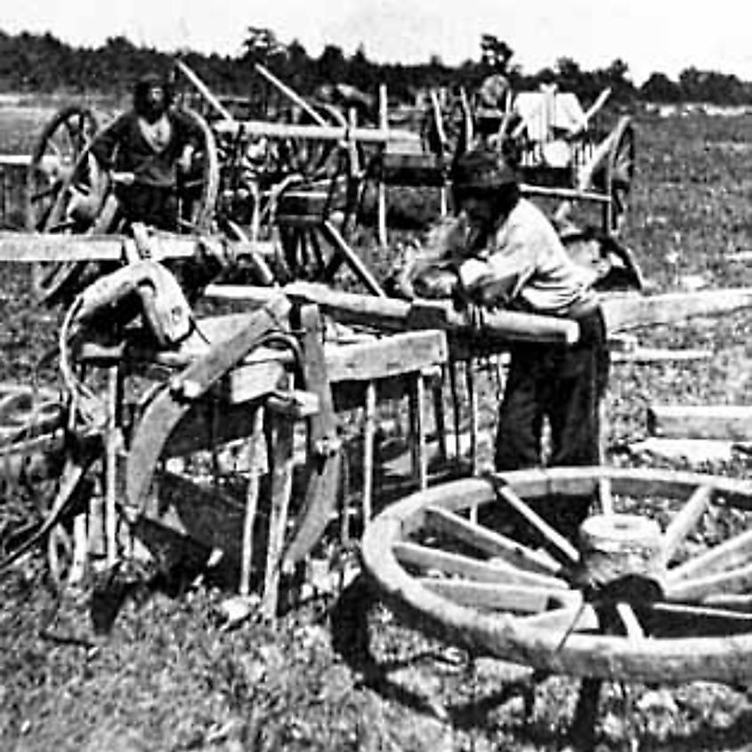 Preparing Red River ox cart at Pembina, North Dakota for trip to St. Anthony Falls, Minnesota.