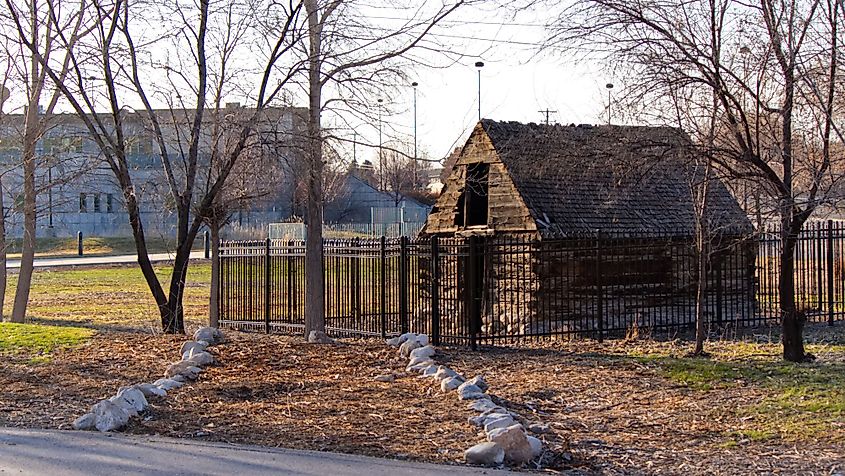 An old building behind the Utah Cultural Celebration Center being preserved behind a closed gate in West Valley City, Utah.