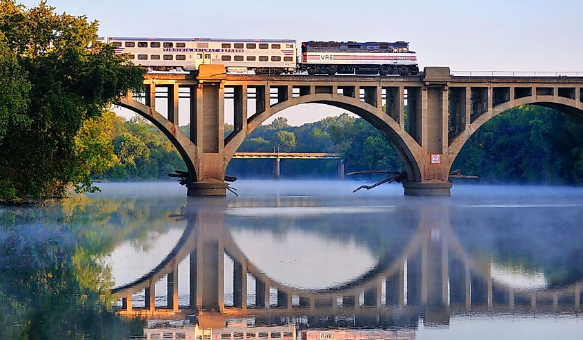 An early morning Virgina Railway Express commuter train passes over the Rappahannock River en route to Washington, D.C