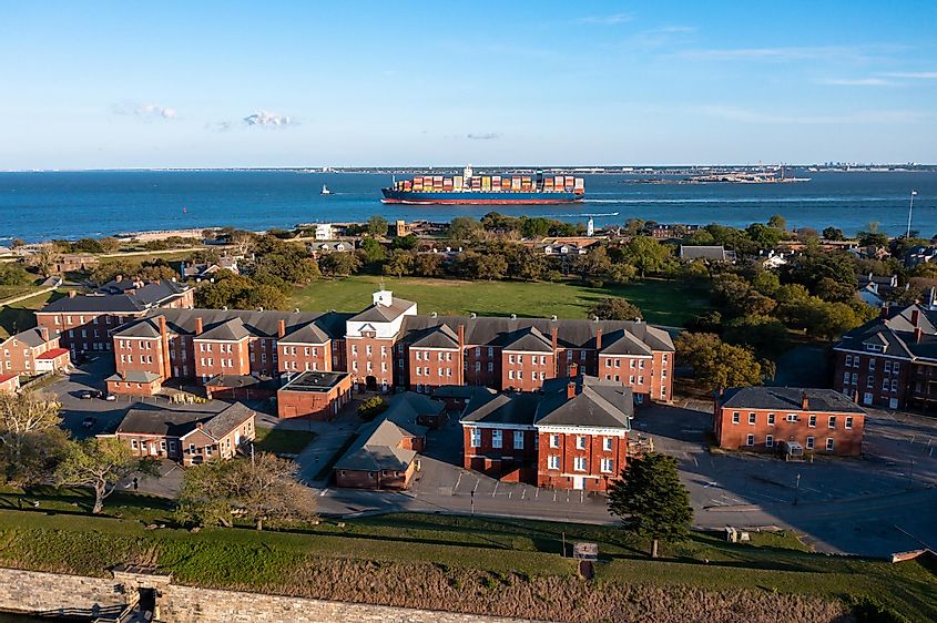 Aerial view of Fort Monroe as a container ship passes by in the Chesapeake Bay