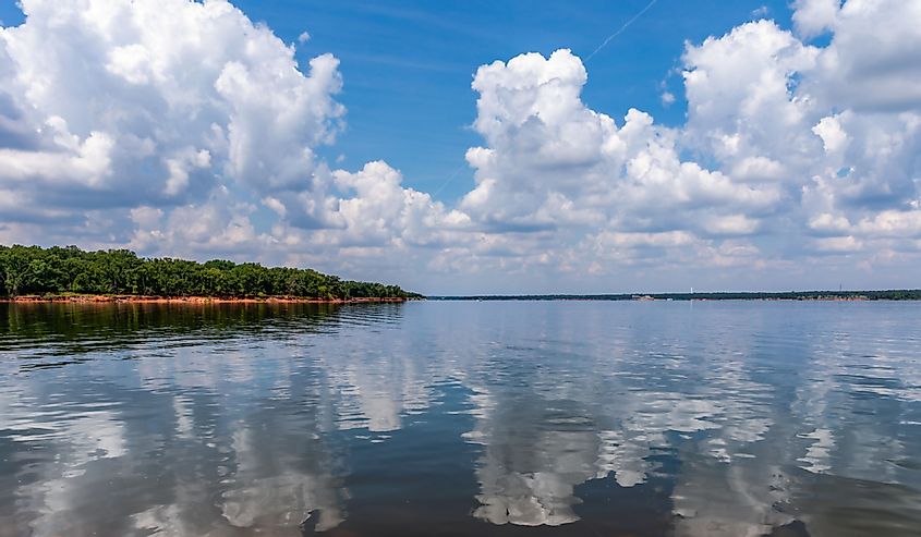 A senic view of the clouds reflecting in the water at Thunderbird Lake in Oklahoma.