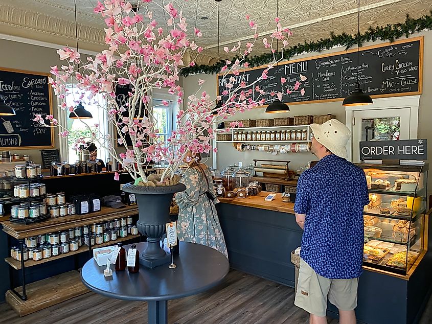 A man eyes up the menu options inside a boutique cafe.