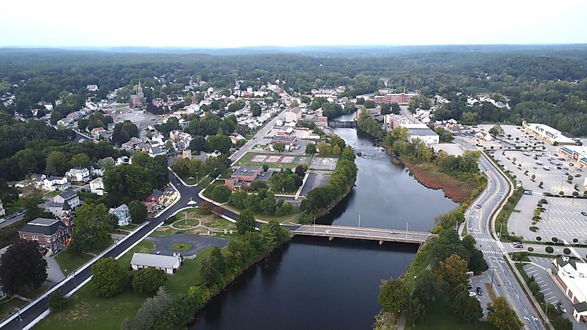 An aerial view of a small town Putnam, Connecticut with a river running through it