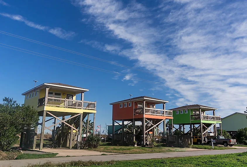 Row of colorful houses built on high stilts on the coast of Louisiana, Holly Beach.