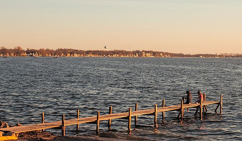 Clear Lake Iowa, two kids sitting on dock