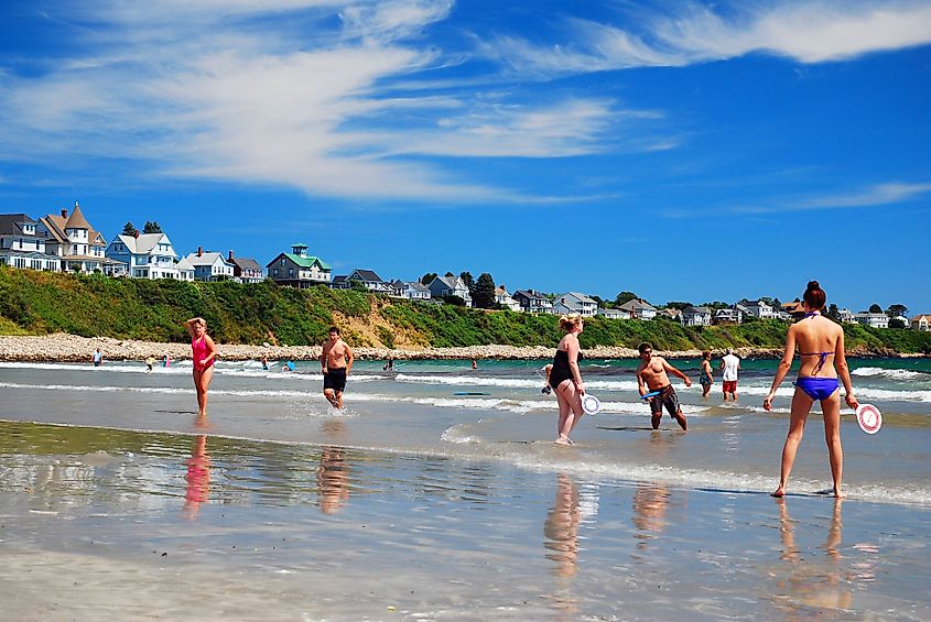 People enjoy playing summer games on Long Sands Beach in York, Maine